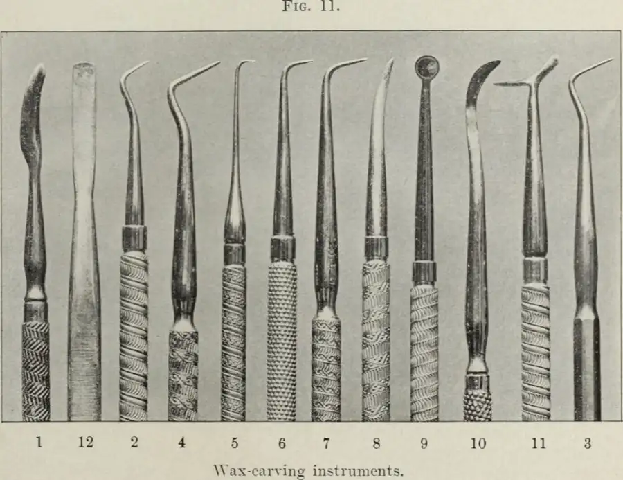 An engraving of eleven dental wax carving instruments with patterned handles