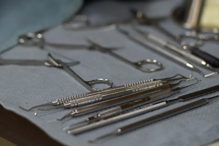 Dental instruments laid out on a tray