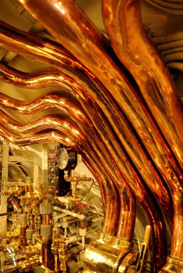 Copper refrigerant and water lines bent in parallel runs